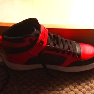 I am selling a pair of red and black champion shoes they are 9.5 in mens.